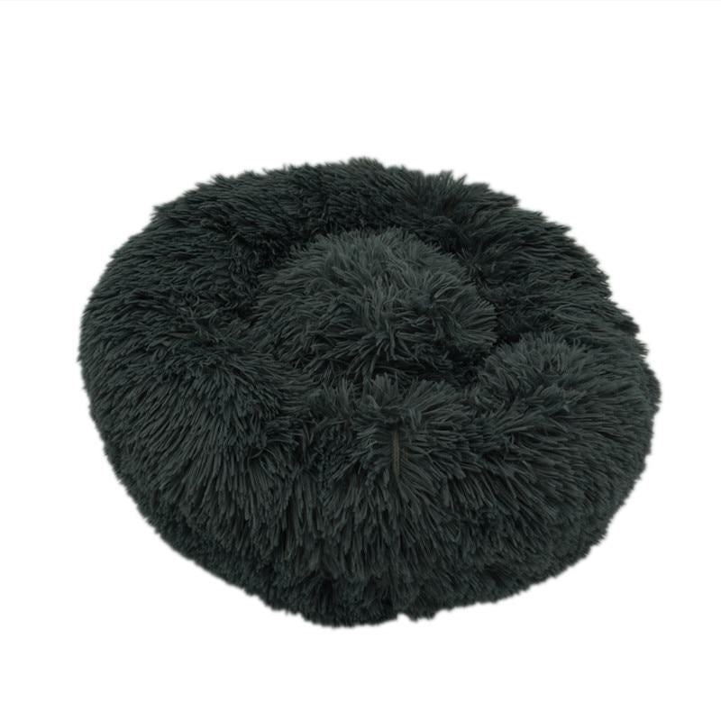 Ultra-soft dark gray calming donut bed for dogs and cats to relax and sleep comfortably