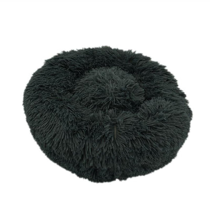 Ultra-soft dark gray calming donut bed for dogs and cats to relax and sleep comfortably