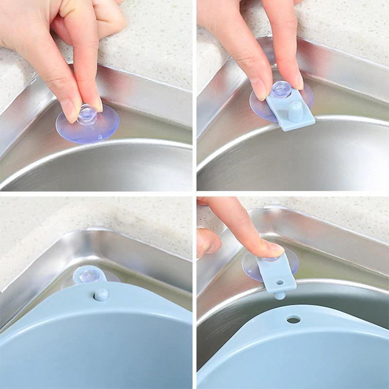 Kitchen sink drain basket organizer attached to sink with suction cups
