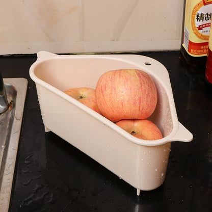 Kitchen sink drain basket organizer in use holding fresh apples