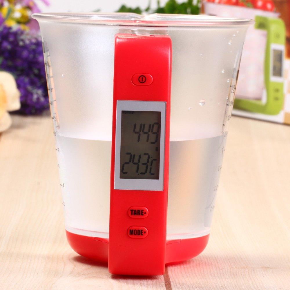 LCD kitchen scale with measuring cup showing real-time ingredient measurement