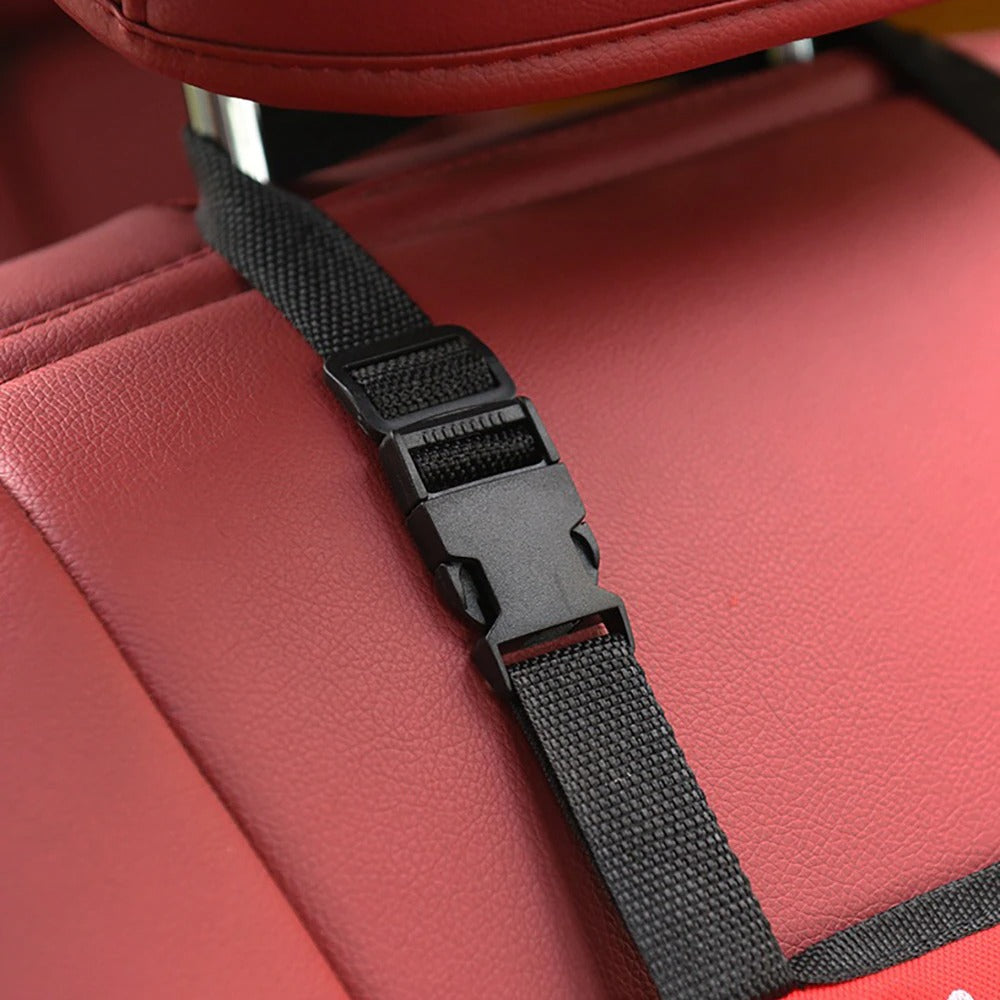 Close-up of pet car hammock strap securely attached to car seat for safety