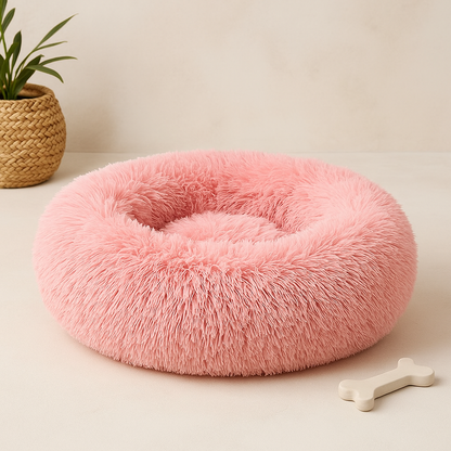 Pink calming donut bed designed for dogs and cats, providing ultra-soft comfort