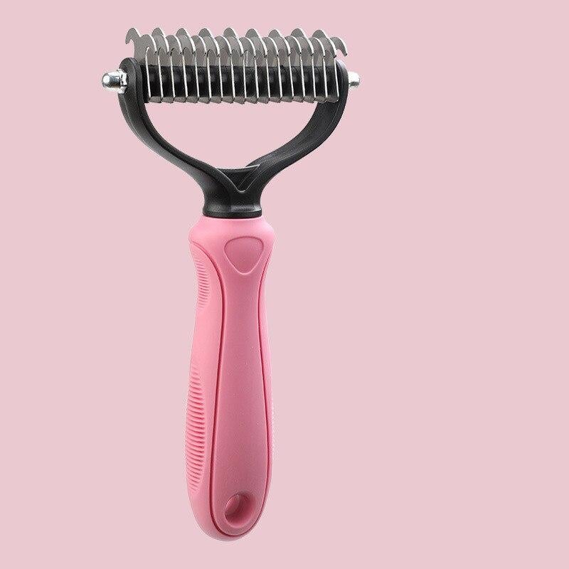 Pink pet grooming rake for removing tangles and loose fur