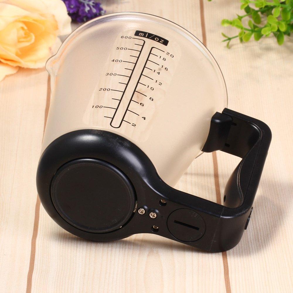 LCD kitchen scale with measuring cup for accurate ingredient measurement