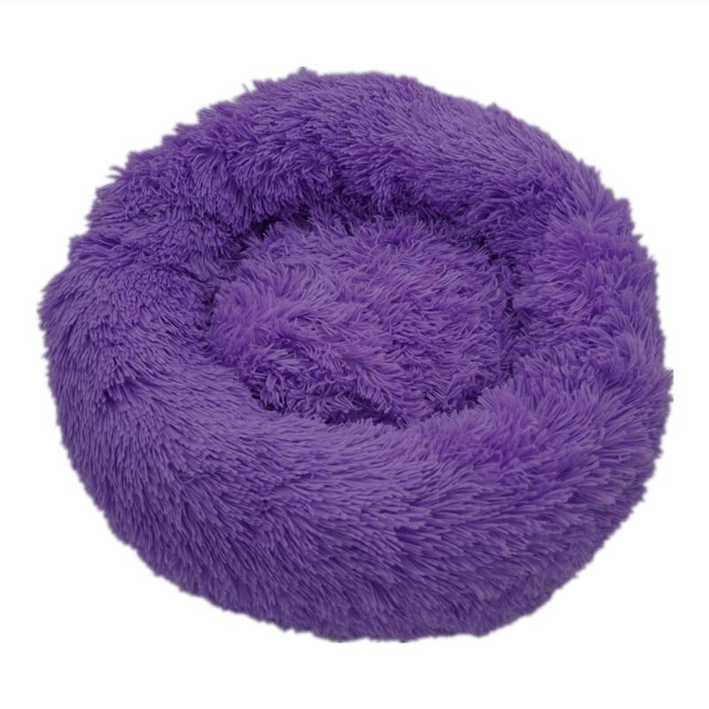Purple calming donut bed designed for dogs and cats, providing ultra-soft comfort