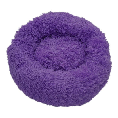 Purple calming donut bed designed for dogs and cats, providing ultra-soft comfort