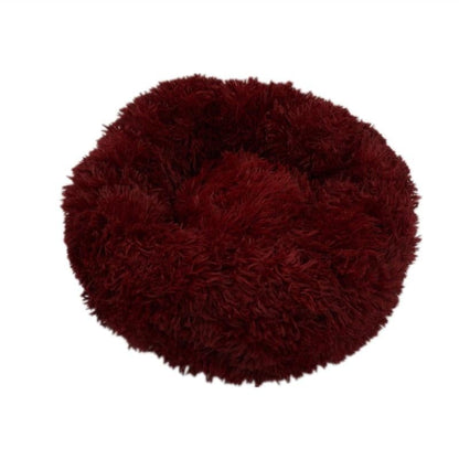Ultra-soft red calming donut bed for dogs and cats to relax and sleep comfortably