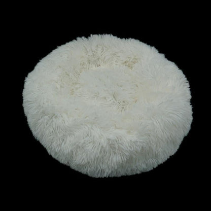 Ultra-soft white pet donut bed for calming and cozy sleeping for dogs and cats